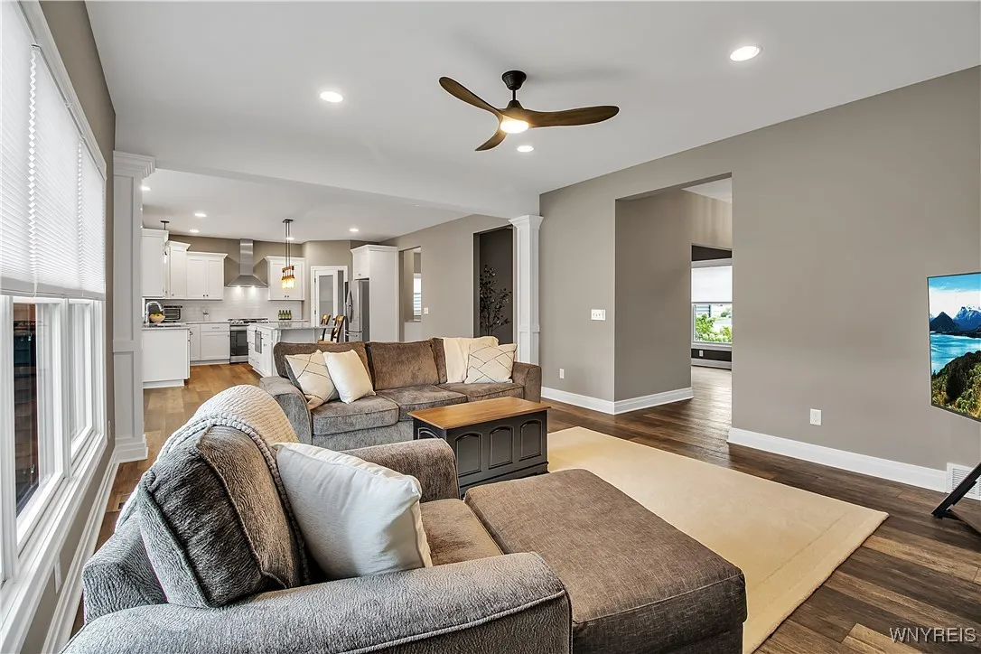 Family room with kitchen and dining room shown in background