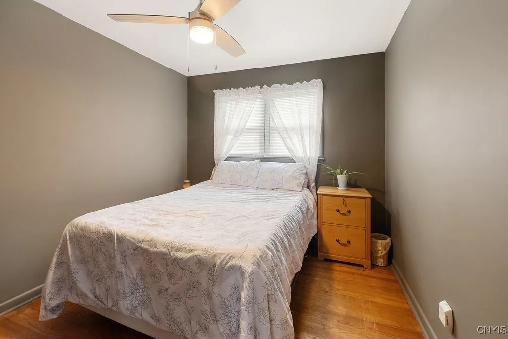 Bedroom 3 is cozy with a deeper closet and hardwood floors as well as a light and adjustable speed ceiling fan.