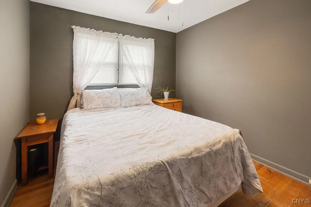 Bedroom 3 is cozy with a deeper closet and hardwood floors as well as a light and adjustable speed ceiling fan.
