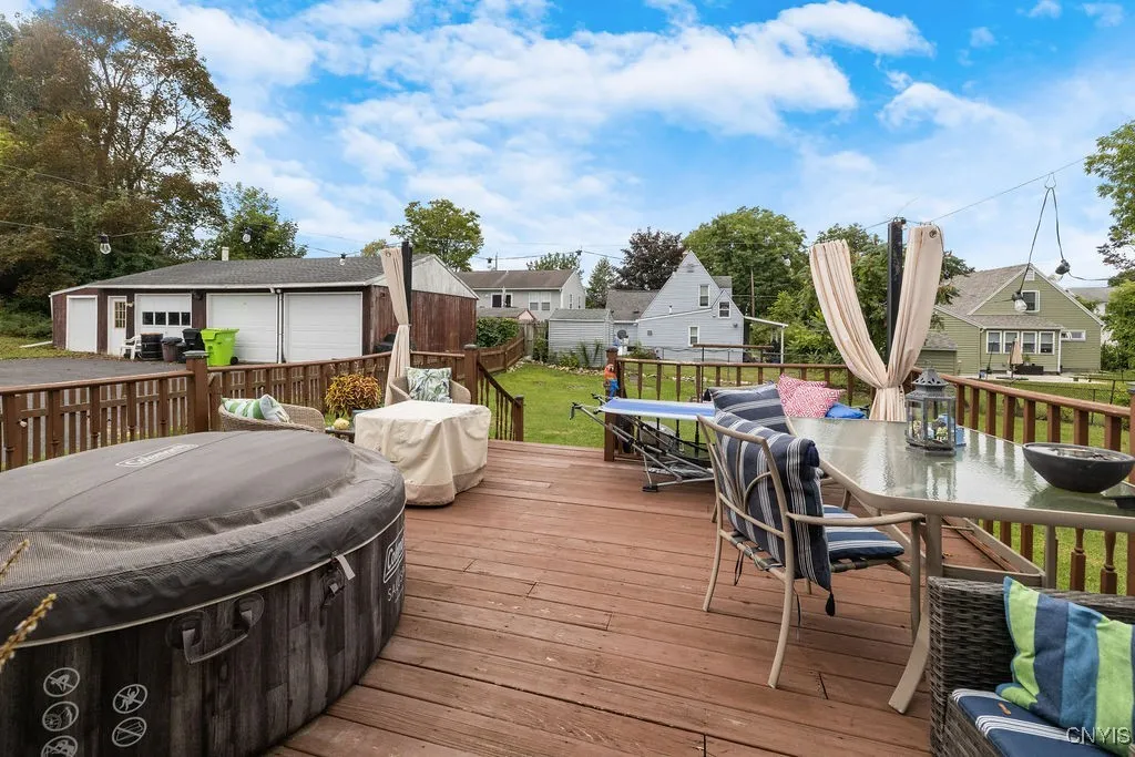 Raised deck leads from kitchen to backyard and is perfect for alfresco dining and entertaining!