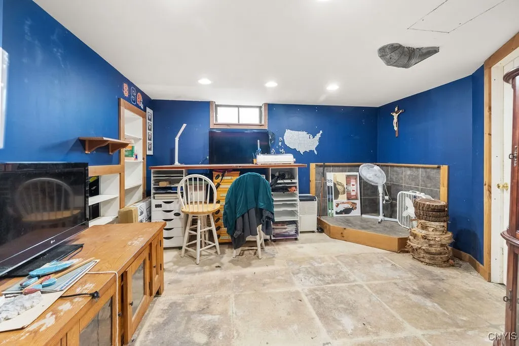 Partially finished basemt is ready to be a new family room or office space. Back corner once held a wood stove.