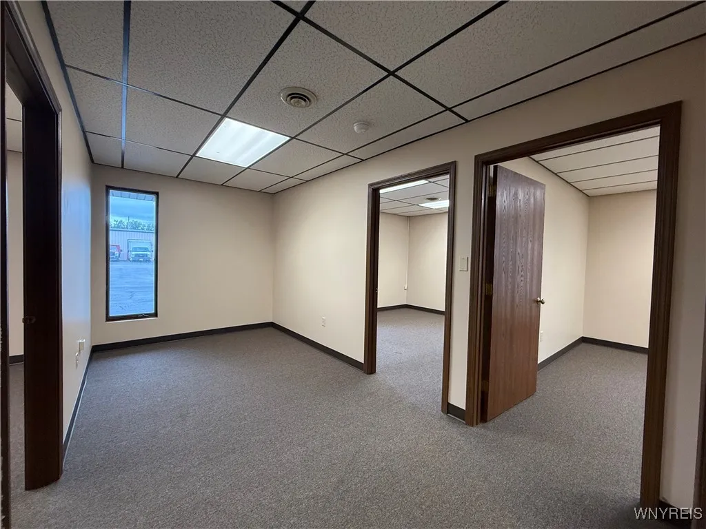 three offices with open area