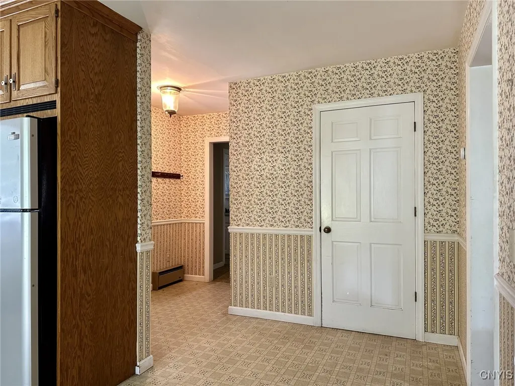 Entryway from Kitchen facing basement door & back mudroom