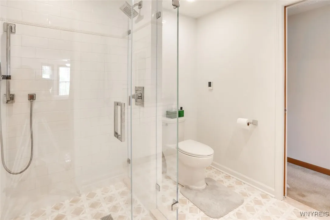 Beautiful tiled shower, frameless glass doors