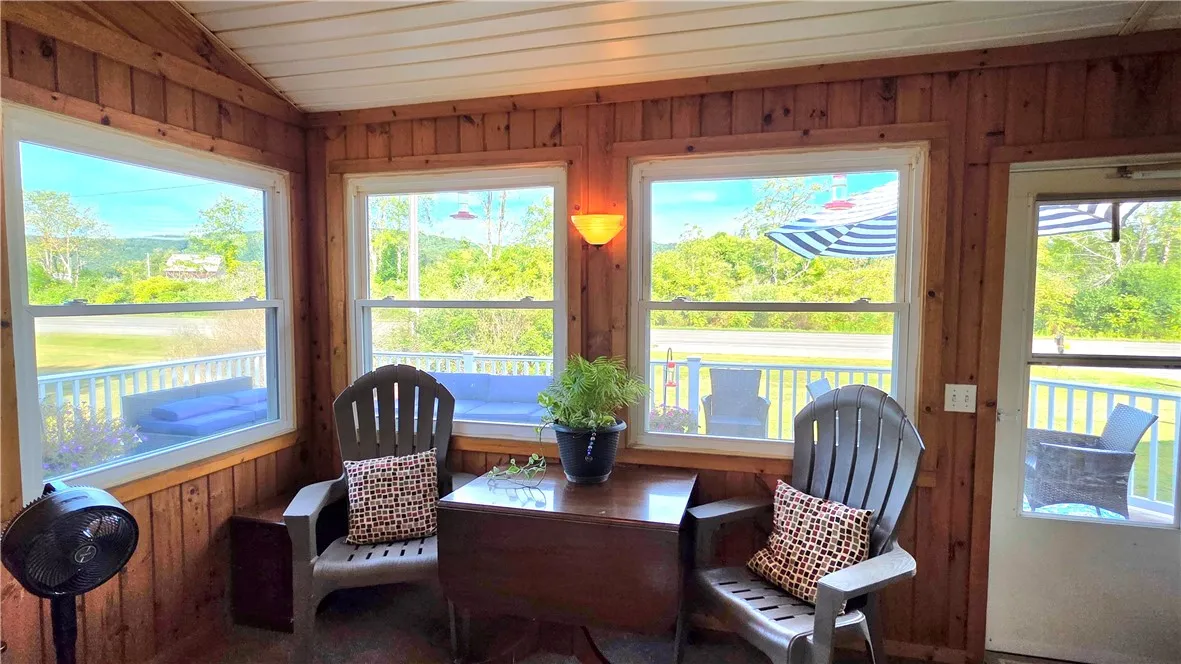 3 Season Room showing entry to wrap around deck