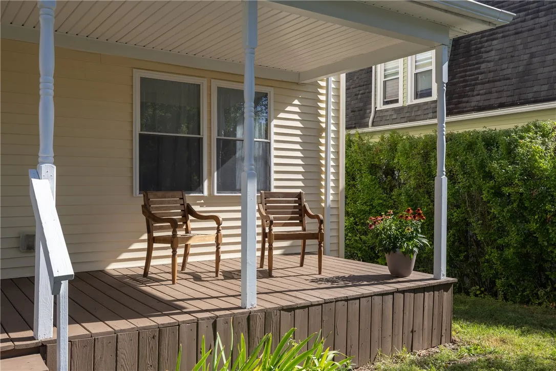 Sweet covered porch to enjoy watching the world go by.
