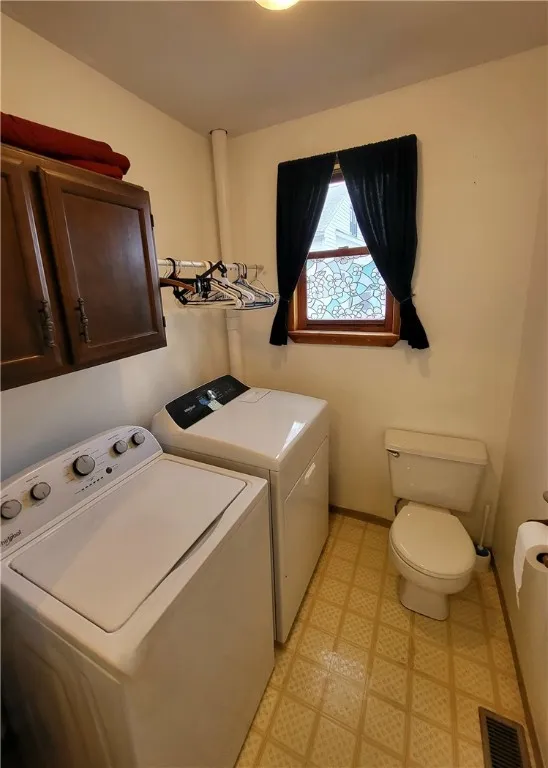Laundry Room with 1/4 Bathroom