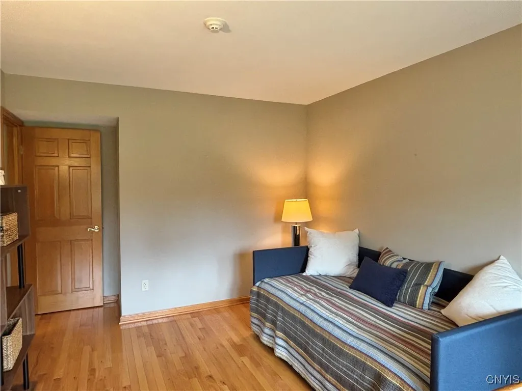 Guest bedroom.  Notice the hardwood floor.