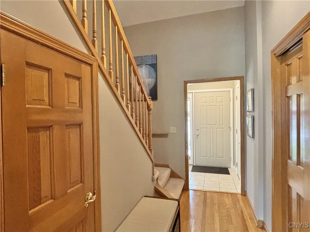 Coat closet is on the right.  Under stairs storage closet is on the left.