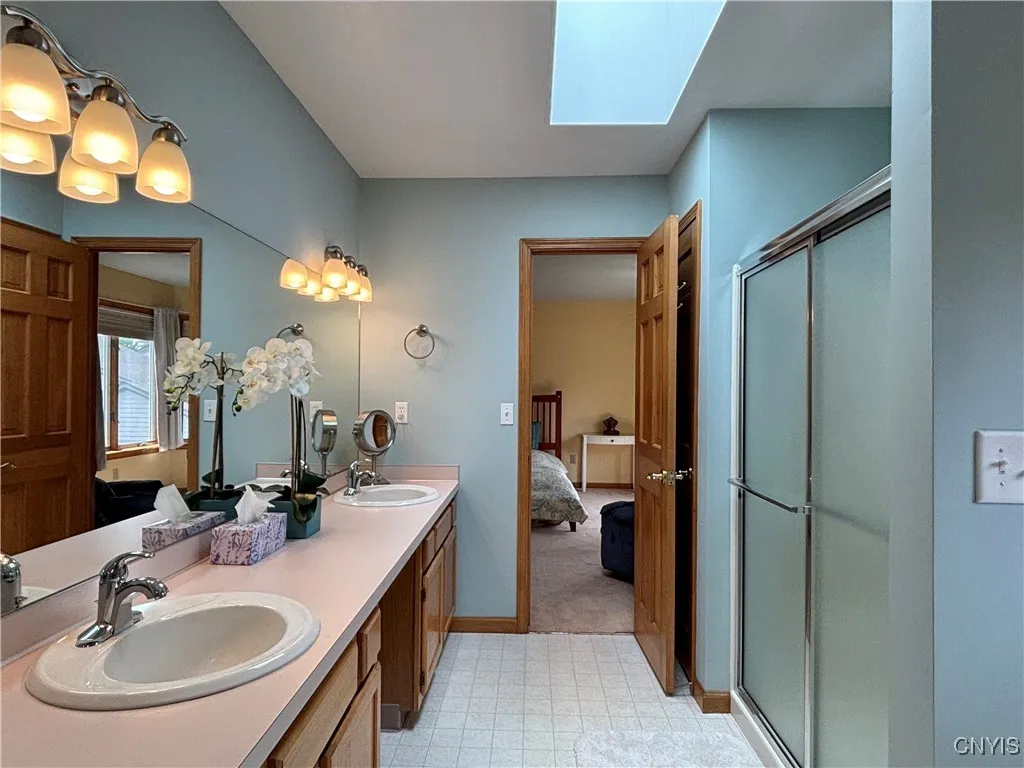 Primary bathroom.  Notice the skylight.