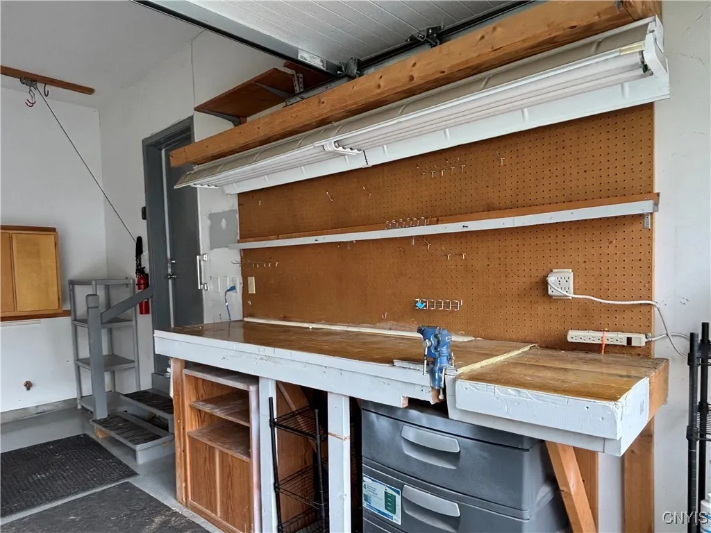 Workbench in heated garage.  Entry door to the foyer is in the background