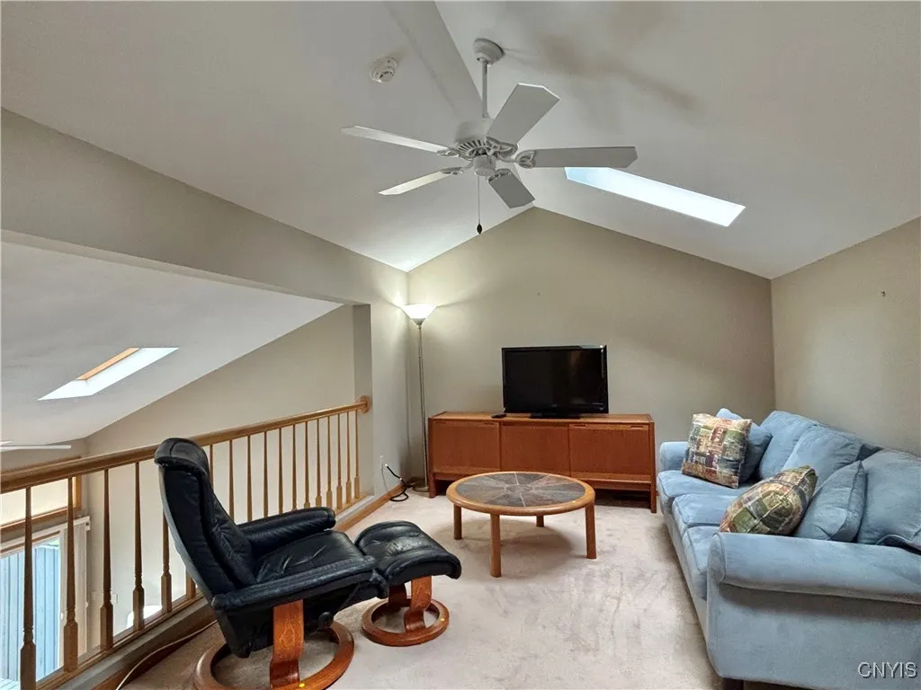 Loft.  Notice the ceiling fan and skylights.