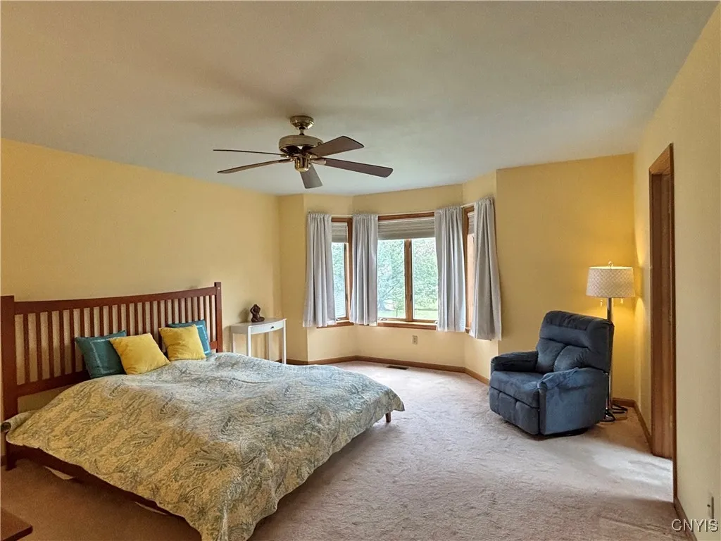 Primary bedroom.  Notice the ceiling fan.