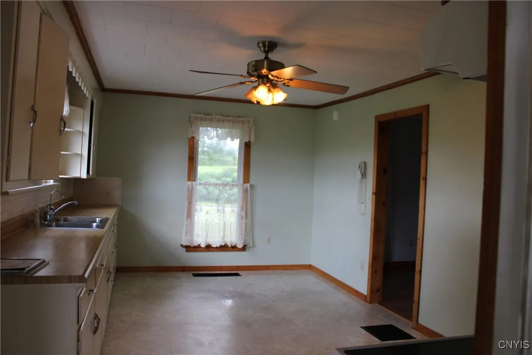 KITCHEN WITH EAT-IN AREA- FROM GARAGE
