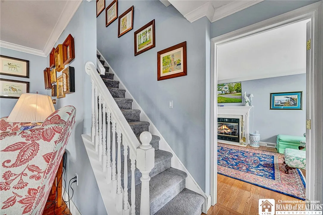 As we pass through the Main great room, one sees the first stairway to the second level and just beyond it .....