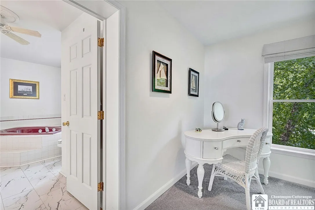 The space includes a large area for a desk and closet.