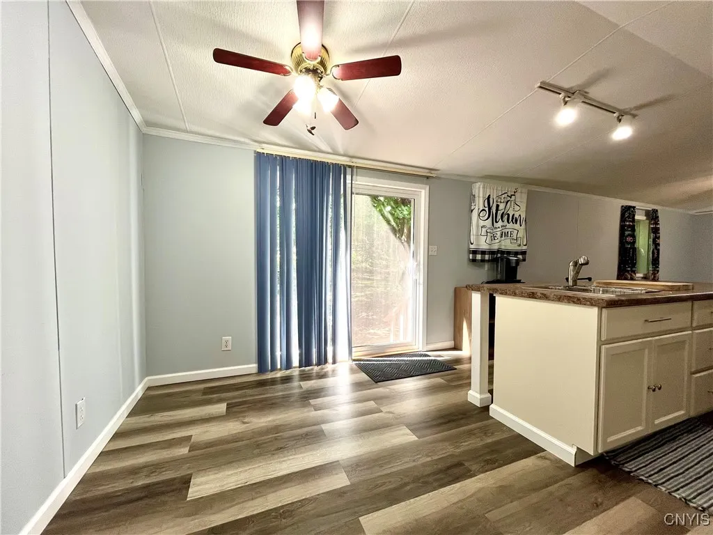 Dining area has new atrium doors leading to the big back yard