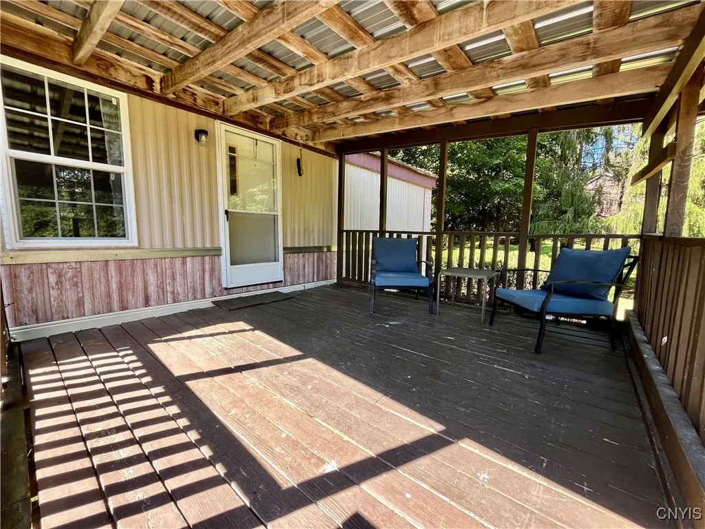 Covered Front porch for relaxing with loved ones.