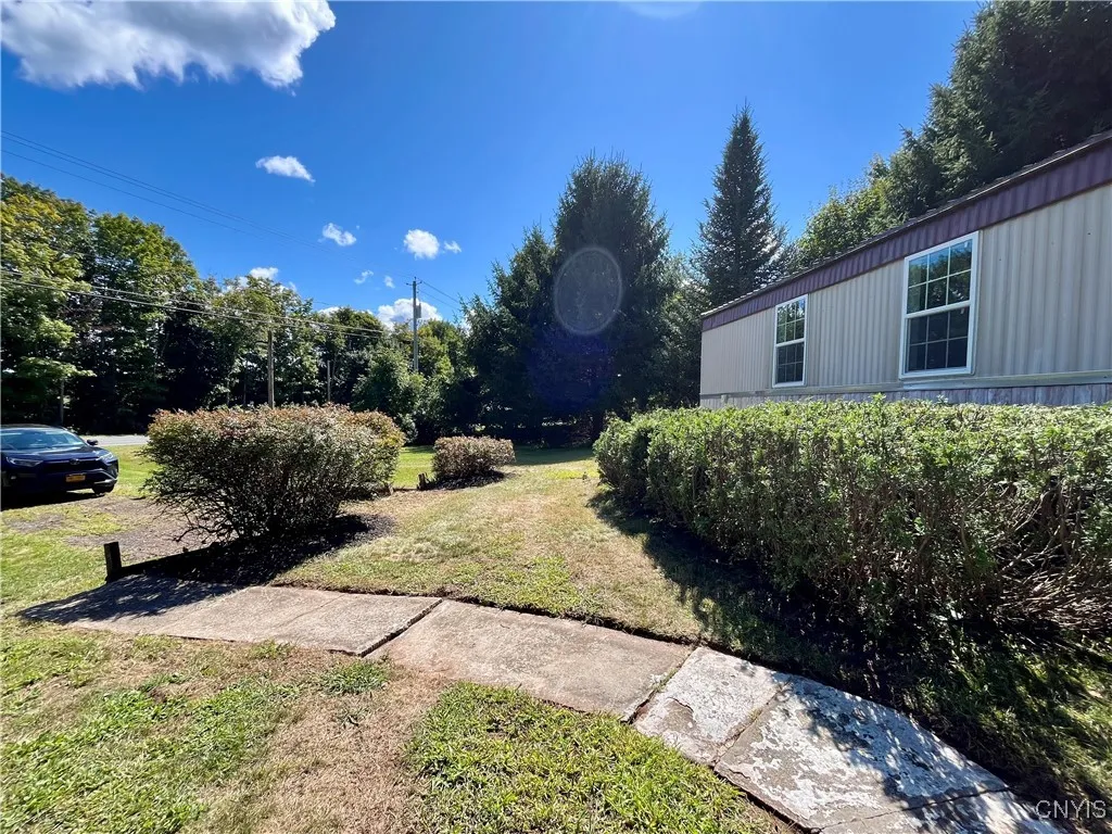 This home is surrounded by mature trees and affords you plenty of privacy!