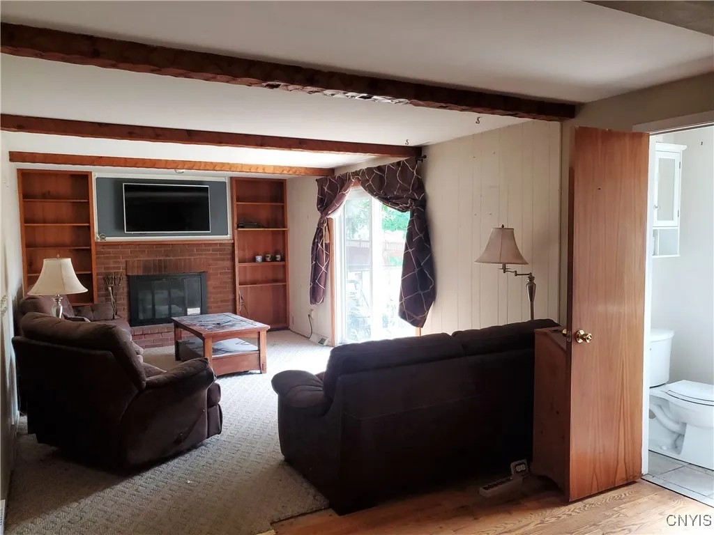 View from the foyer to kitchen (right) family room (left). Half bath is located center.