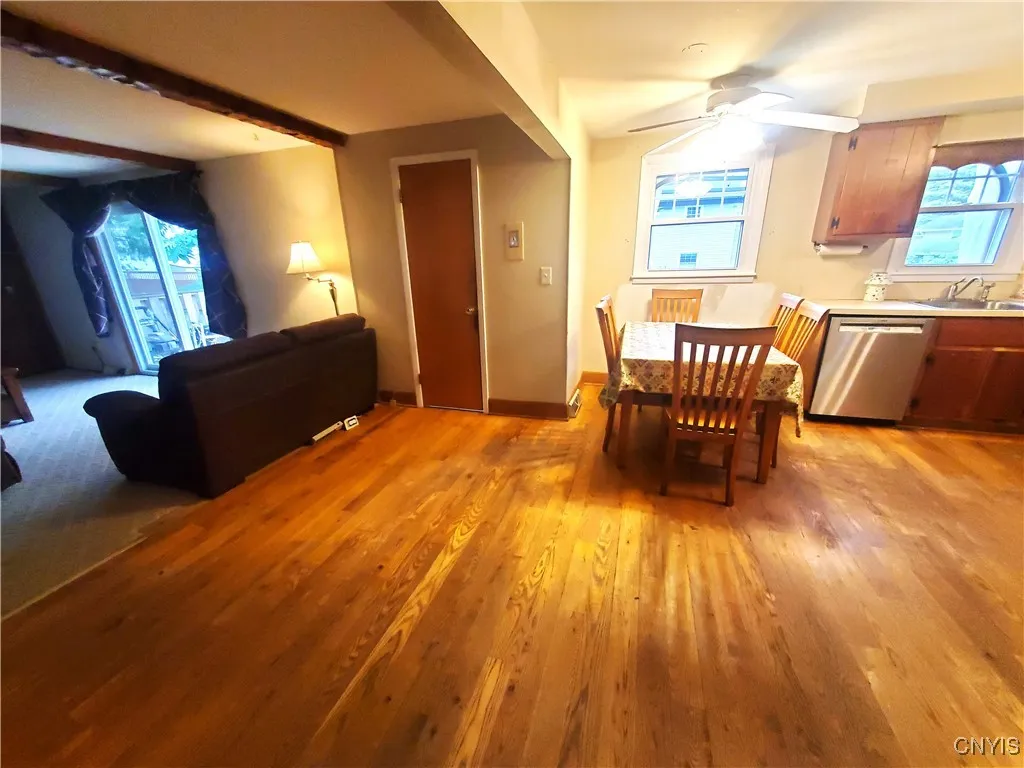 View from the foyer to kitchen (right) family room (left). Half bath is located center.