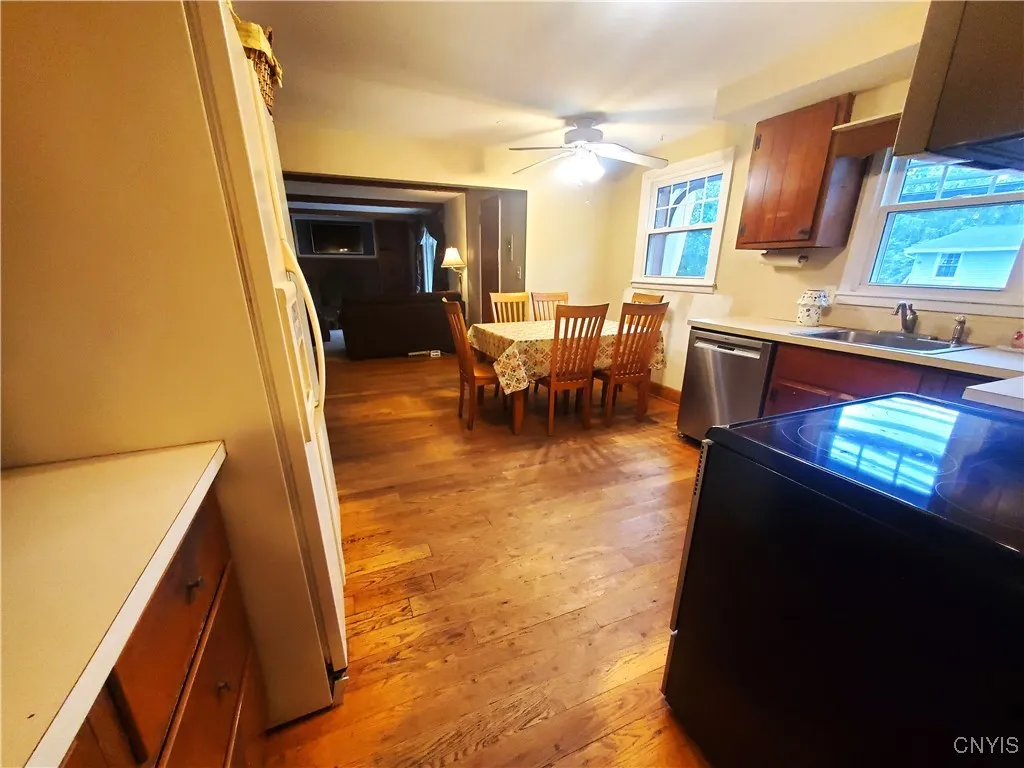 Additional countertop and drawers are located left of refrigerator
