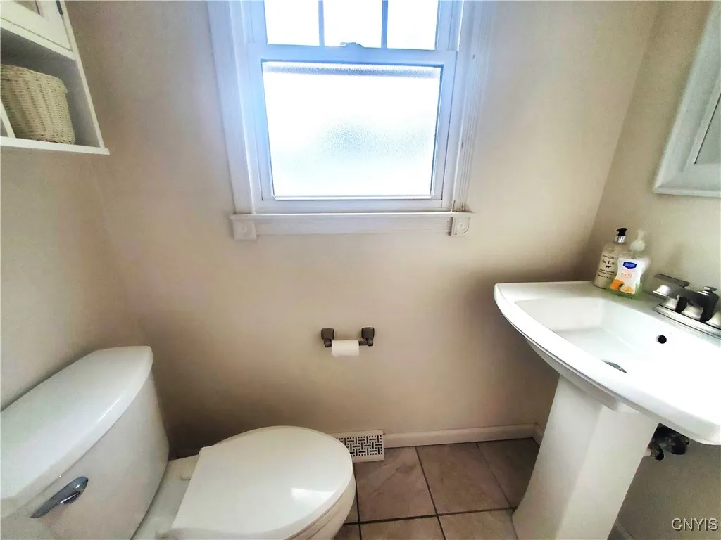 Half bath is located between the family room and the kitchen.