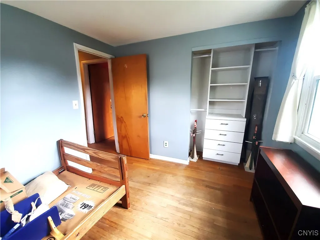 Fourth bedroom with wall unit in the closet.