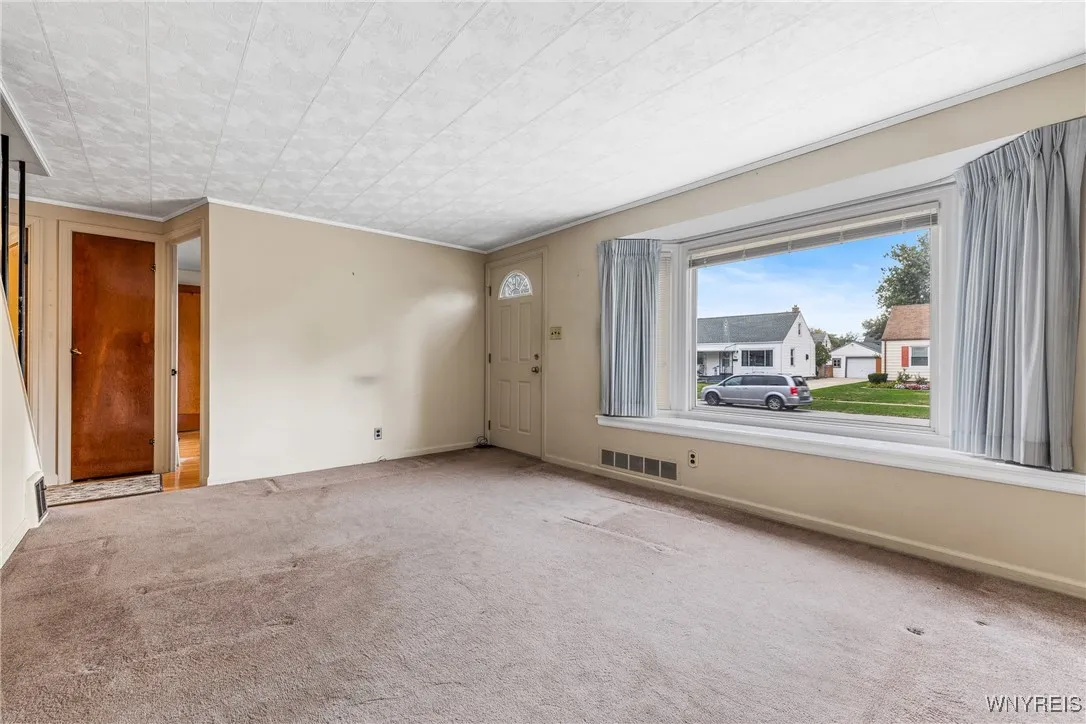 LARGE LIVING ROOM (hardwood floors beneath carpet)