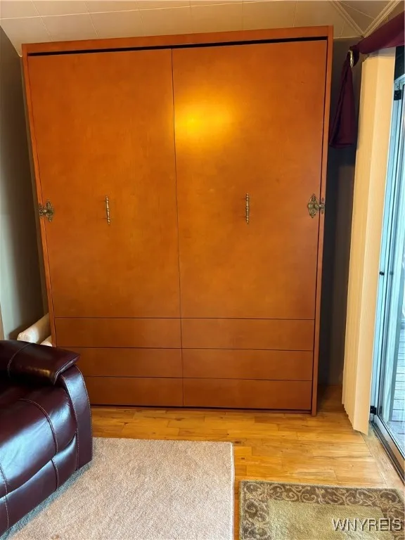 Handsome Furniture Piece for a Queen Size Murphy Bed in the sunroom area