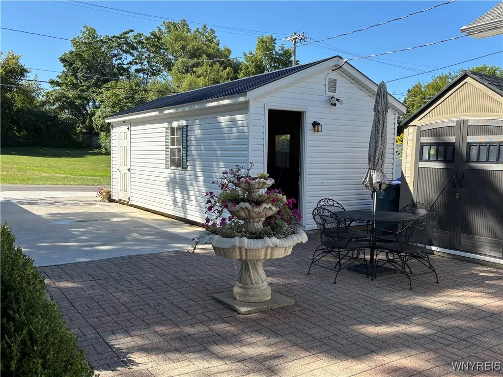 View from front door area to street showing rear of garage