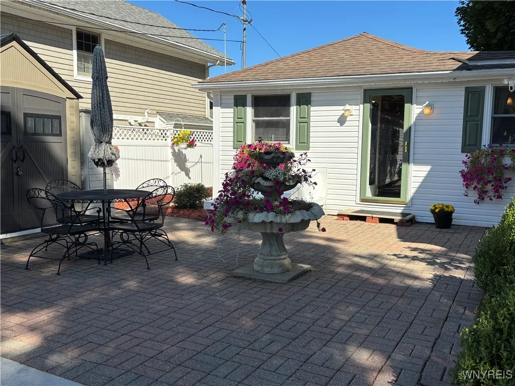 Paver Courtyard with plenty of shed storage