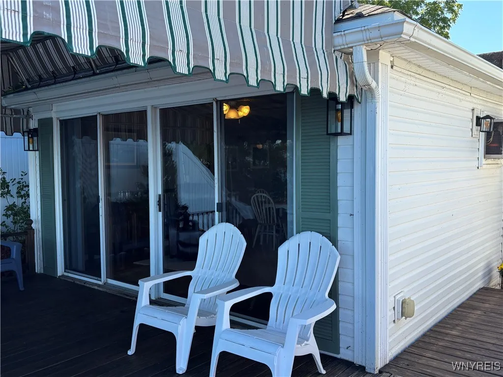 Plenty of seating on this spacious deck overlooking Lake Ontario