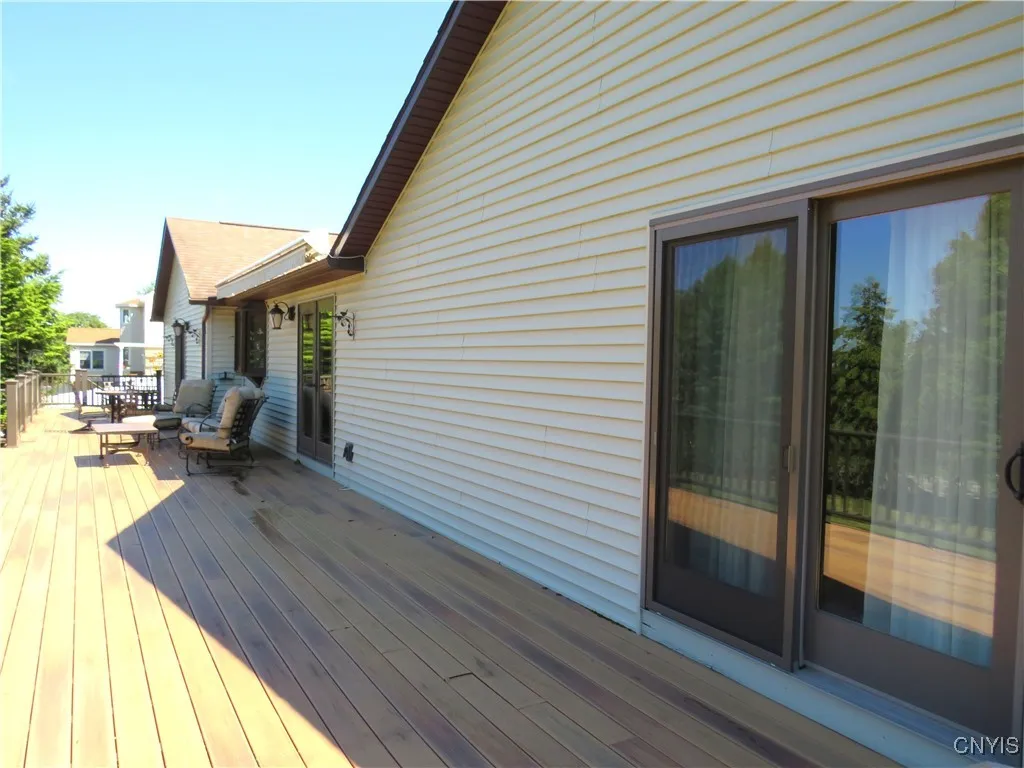 Primary bedroom has sliders to deck