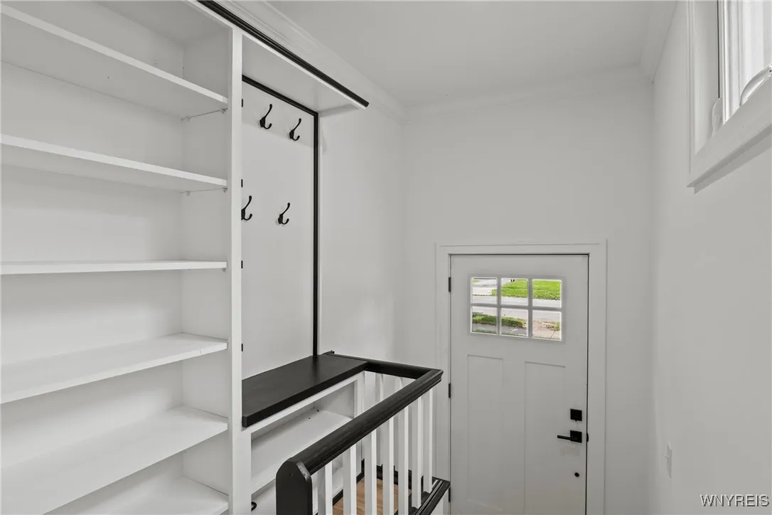 Entryway with coat storage.