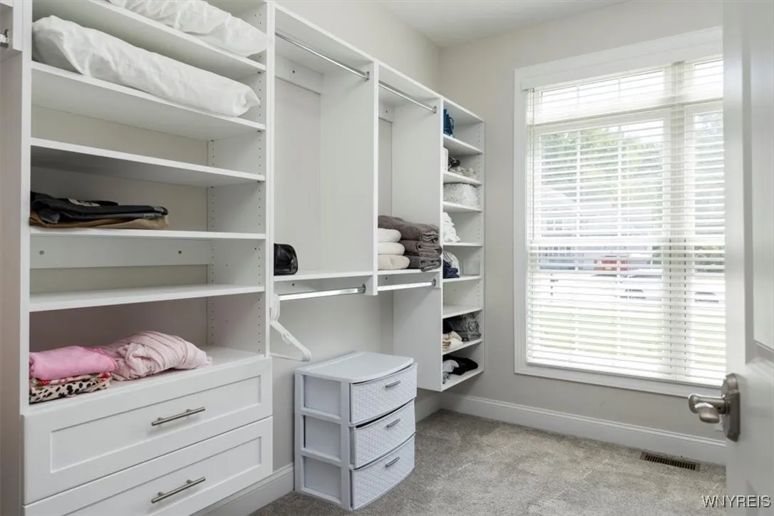 Custom walk-in closet with room for sooo many clothes!