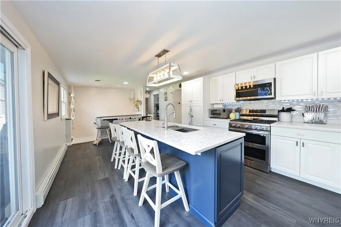 Kitchen island with granite counters and under mount sink
