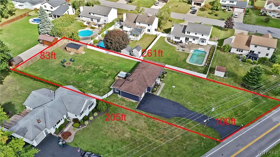 Fully fenced backyard with deck and hot tub