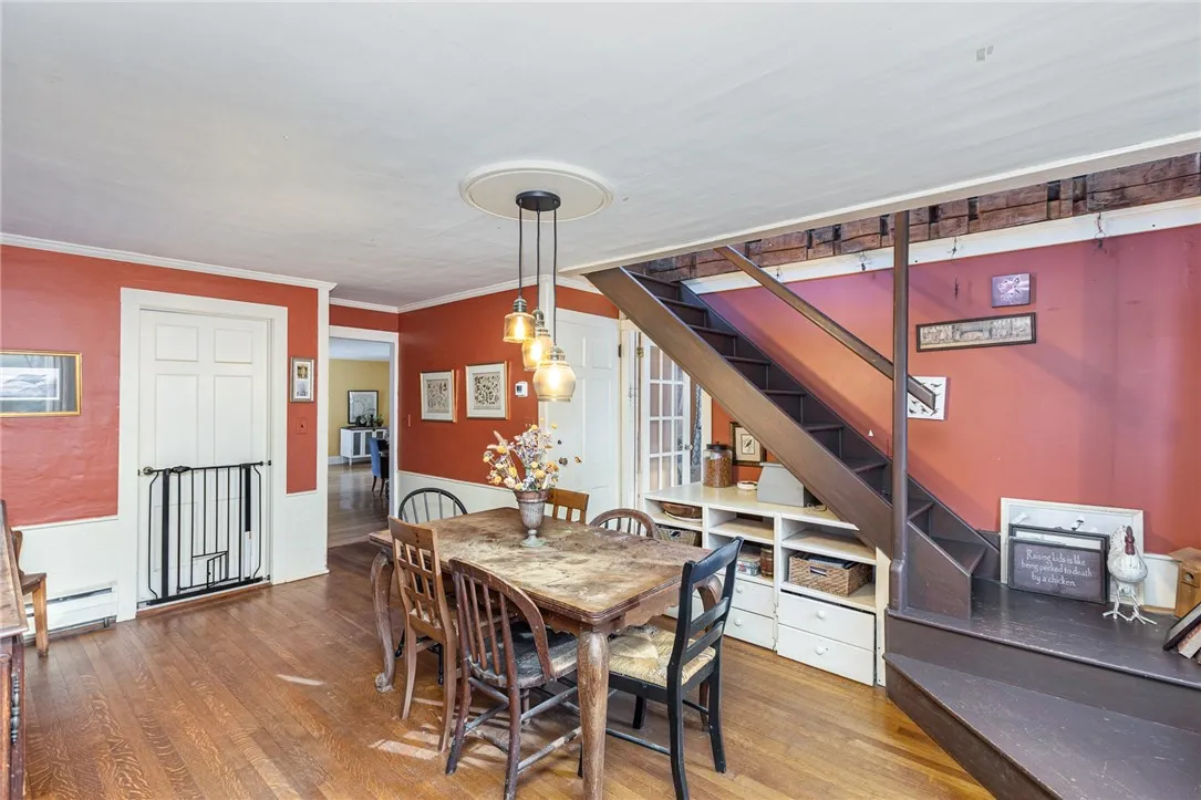Dining area in tandem with kitchen. Spacious size great for large dinner parties. Hardwood floors accent this area and lead into the great room and front rm.