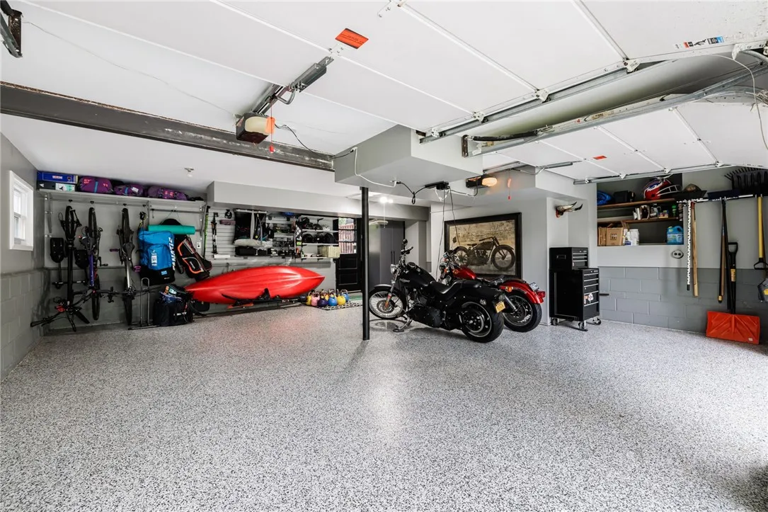 Finished Attached 2 Car Garage with Custom Shelving.
