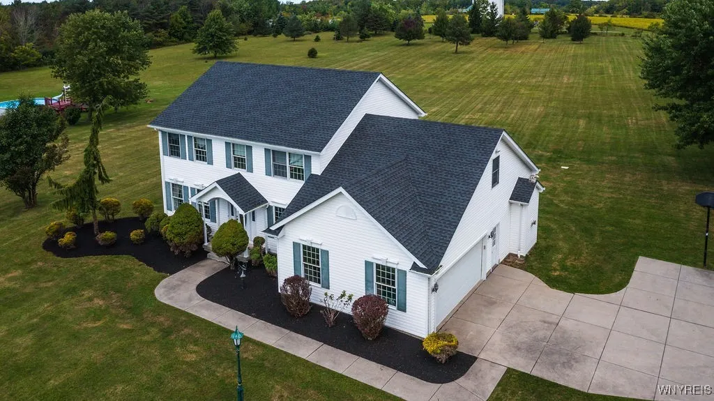 2 car attached garage with convenient turnaround with extra parking spots.