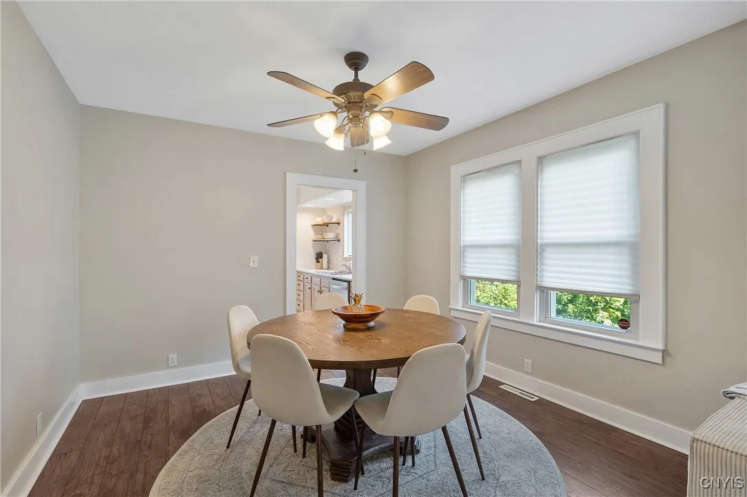 And just look at how these rooms gleam under all of the natural light drenching the interior through the windows along the south wall. Continuing past the dining room, we will explore the adorable eat-in kitchen next.