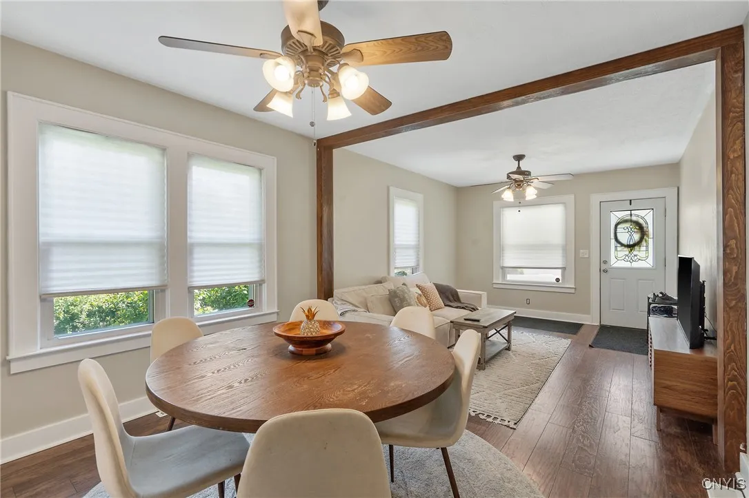The dining room, currently shown with a large 6-person round table, can certainly handle big furniture with no problem.