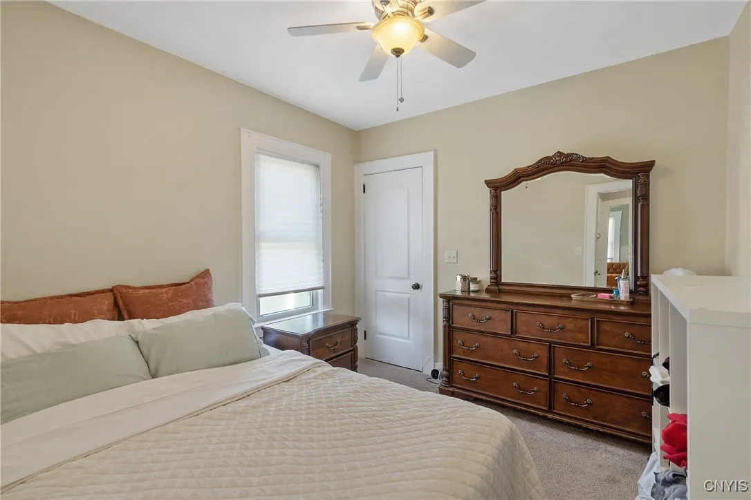 And the second bedroom is also impressive. As well as accessing closet space, the doorway ahead also is home to the stairs leading up to the attic for even more awesome storage options.
