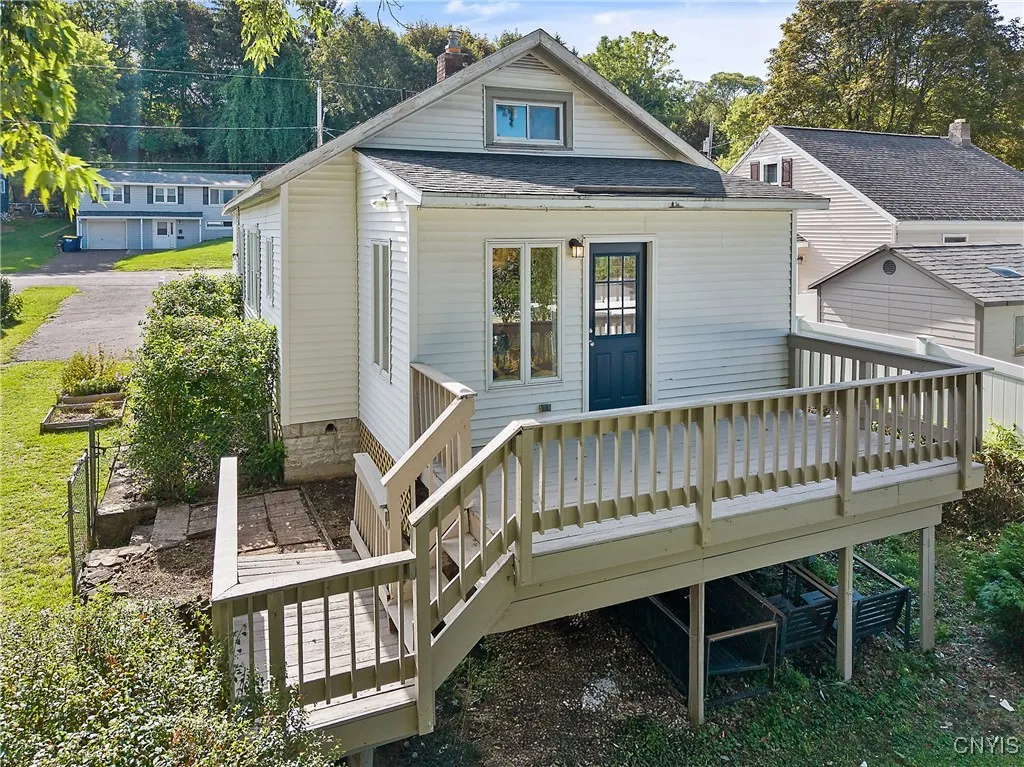 A short stairway carries you down from the deck to access the yard itself while extra space to store equipment is created under the deck.