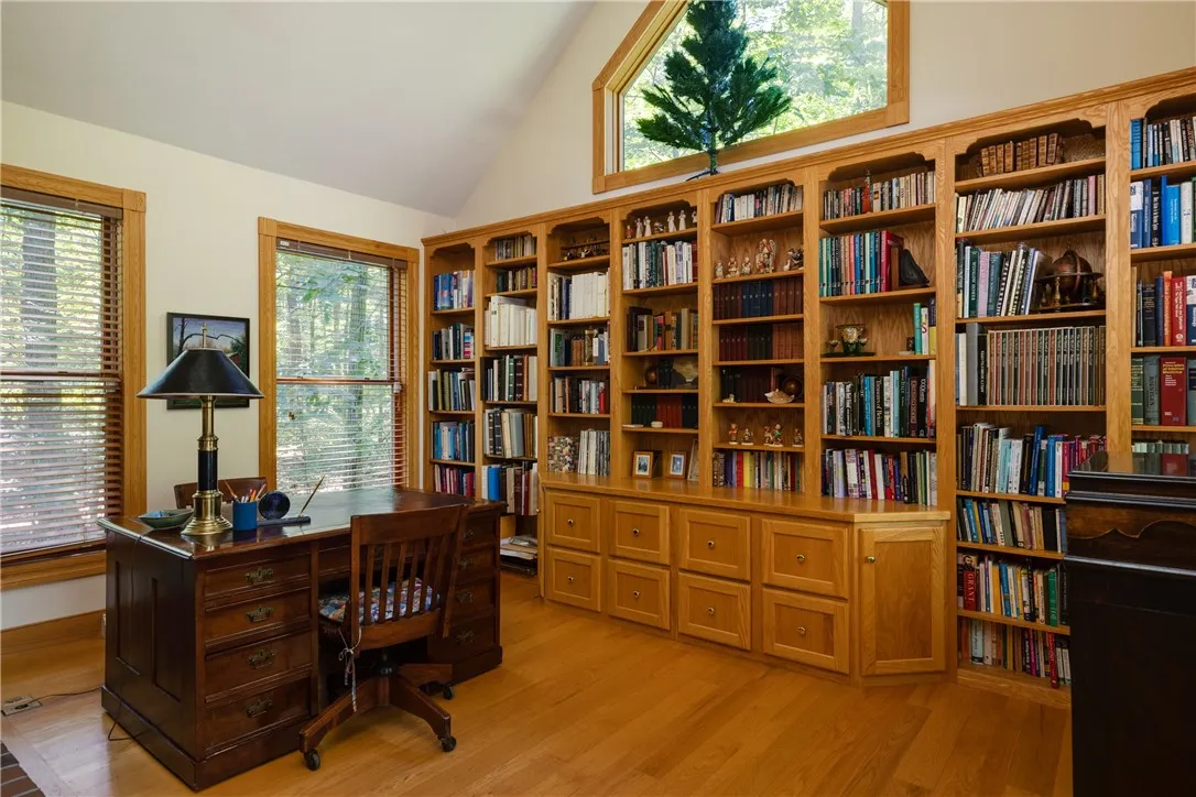 This is a spacious Home office with lots of built-in storage