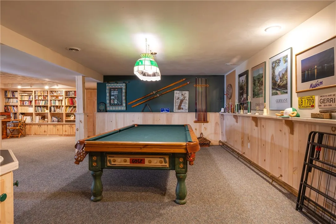Fully finished basement with this space for pool, parties and working out.