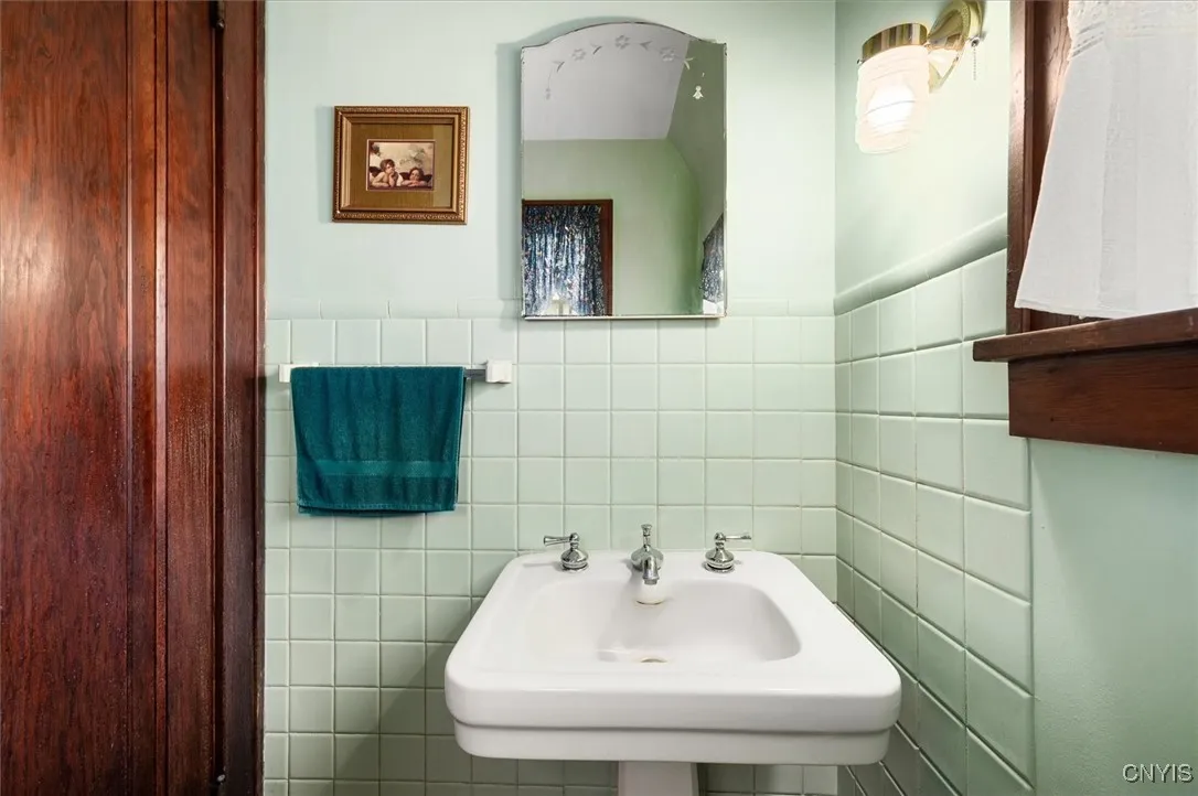 1/2 bath original sink on first floor near entry area!
