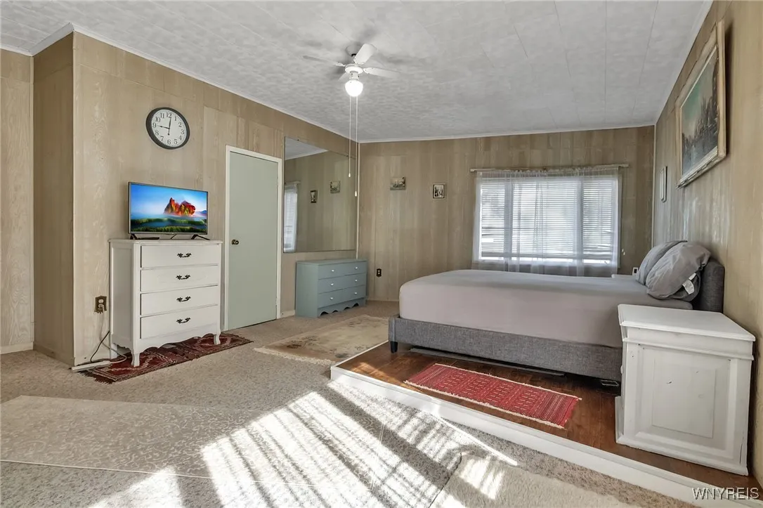 Primary bedroom with a lake view from bed