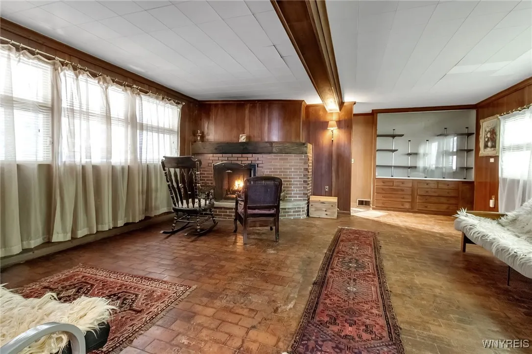A wood burning fireplace anchors the room and adds character and ambiance
